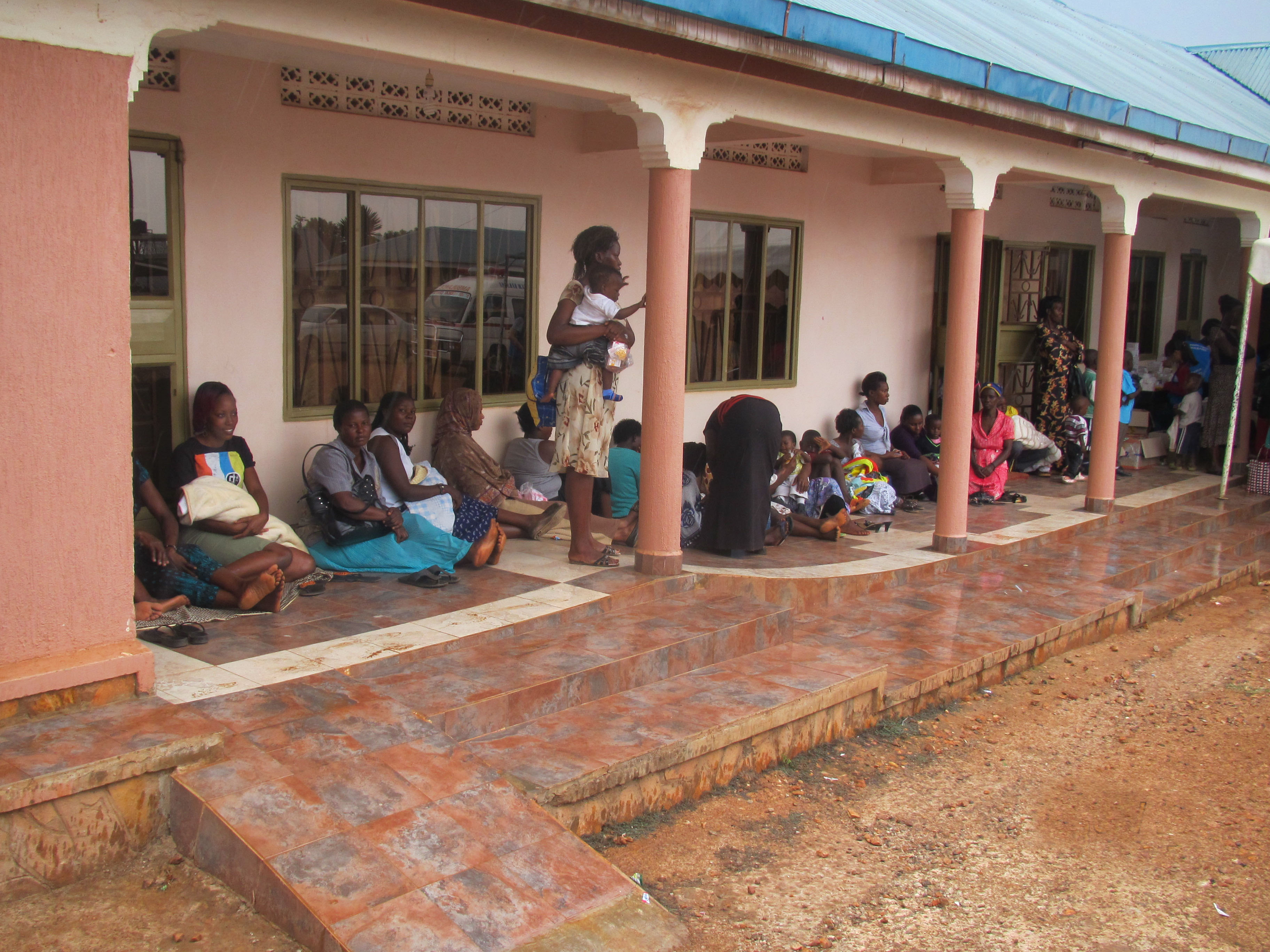 Women Sit Out side the EFIUG hub in Jinja awaiting to see WPE officers.