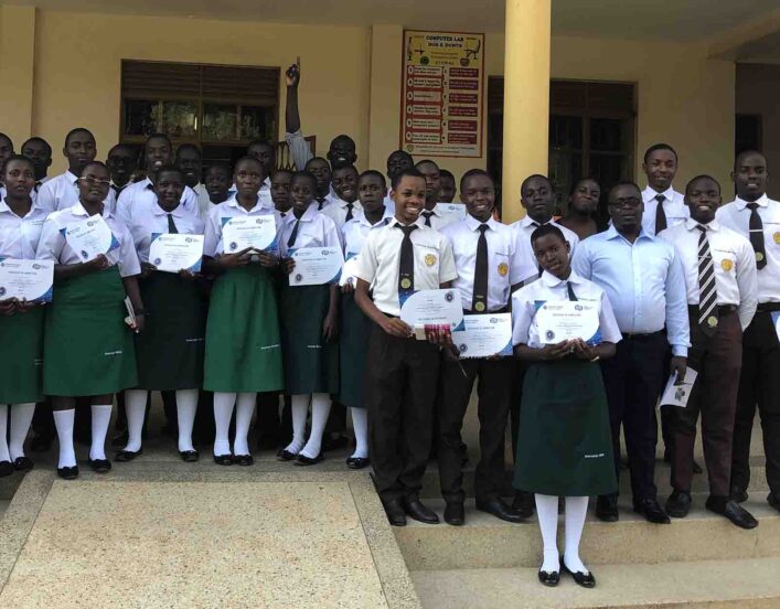 Students from various schools take a group photo with Dr. Busonga after a training in Eastern Uganda